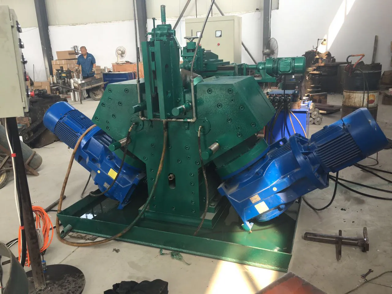 Screw flight cold rolling machine in a factory