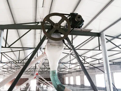 Flexible auger feed line installation Flexible auger feed line installation