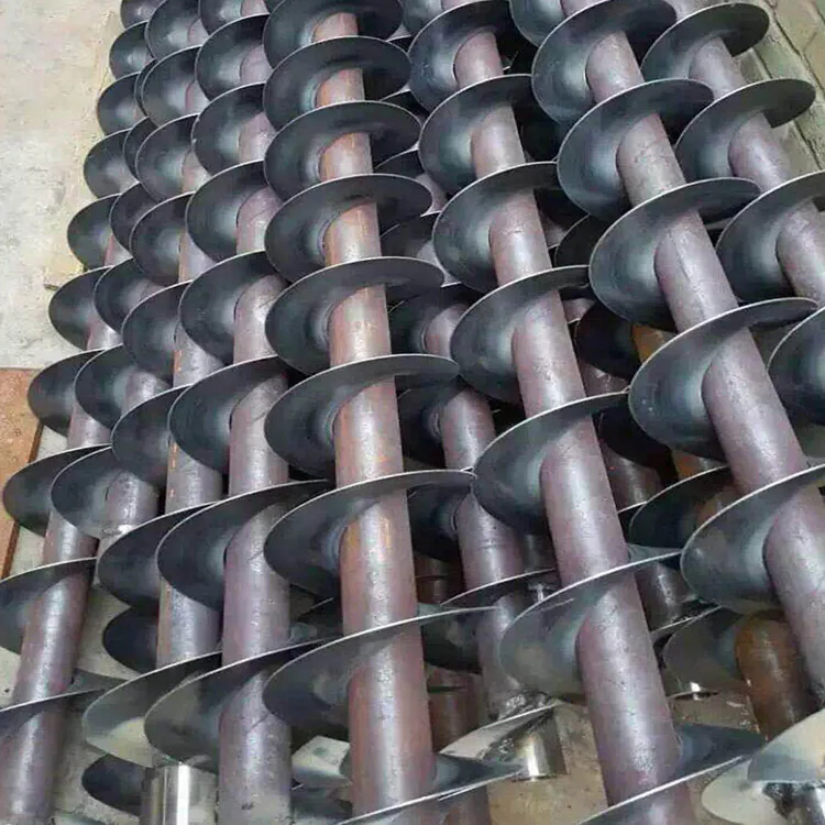 Custom fabricated auger screw assemblies featuring precision screw flight components Custom fabricated auger screw assemblies featuring precision screw flight components